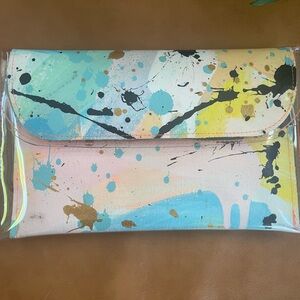 Unique fabric and plastic clutch.